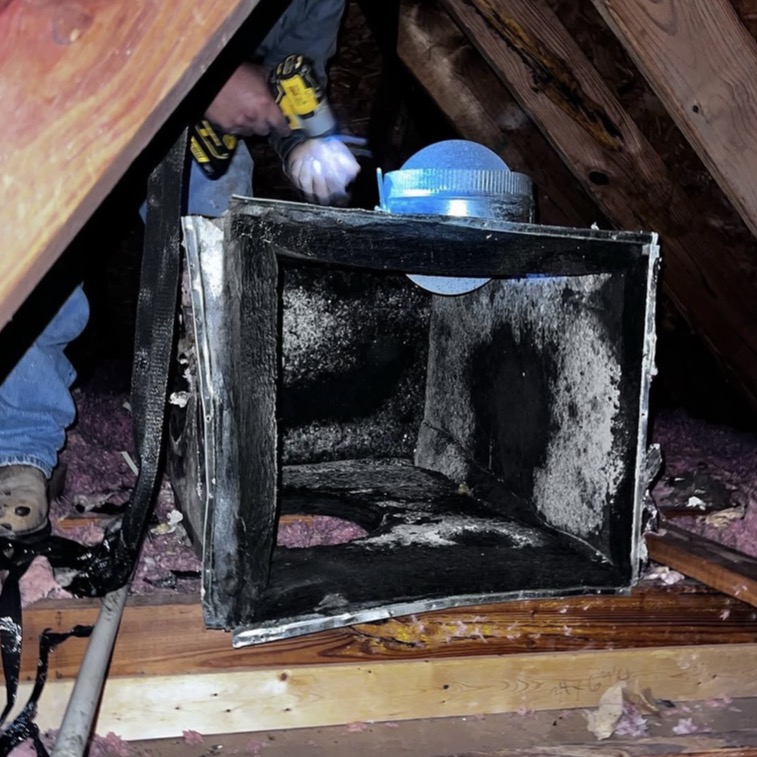 Air duct cleaning inspection photo showing dust and buildup
