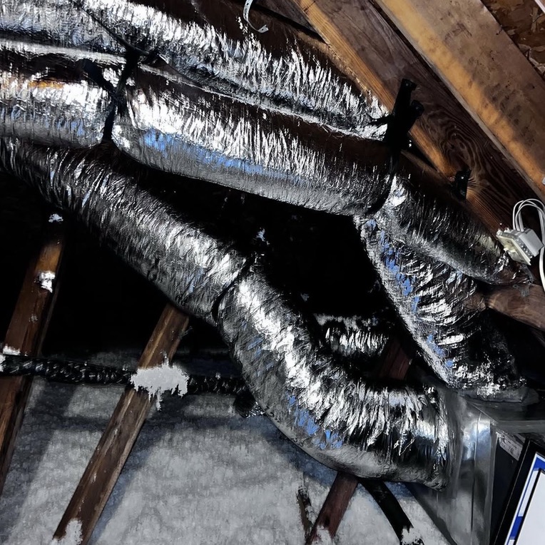 Air duct cleaning inspection photo showing dust and buildup